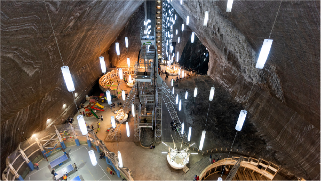 Large underground mining facility with industrial equipment